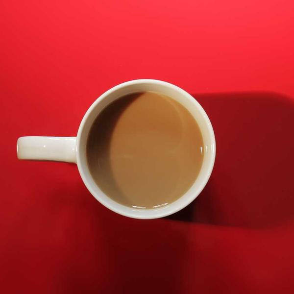 A coffee cup on a red table